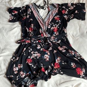 Black and floral summer Maurice’s brand romper with waist tie
